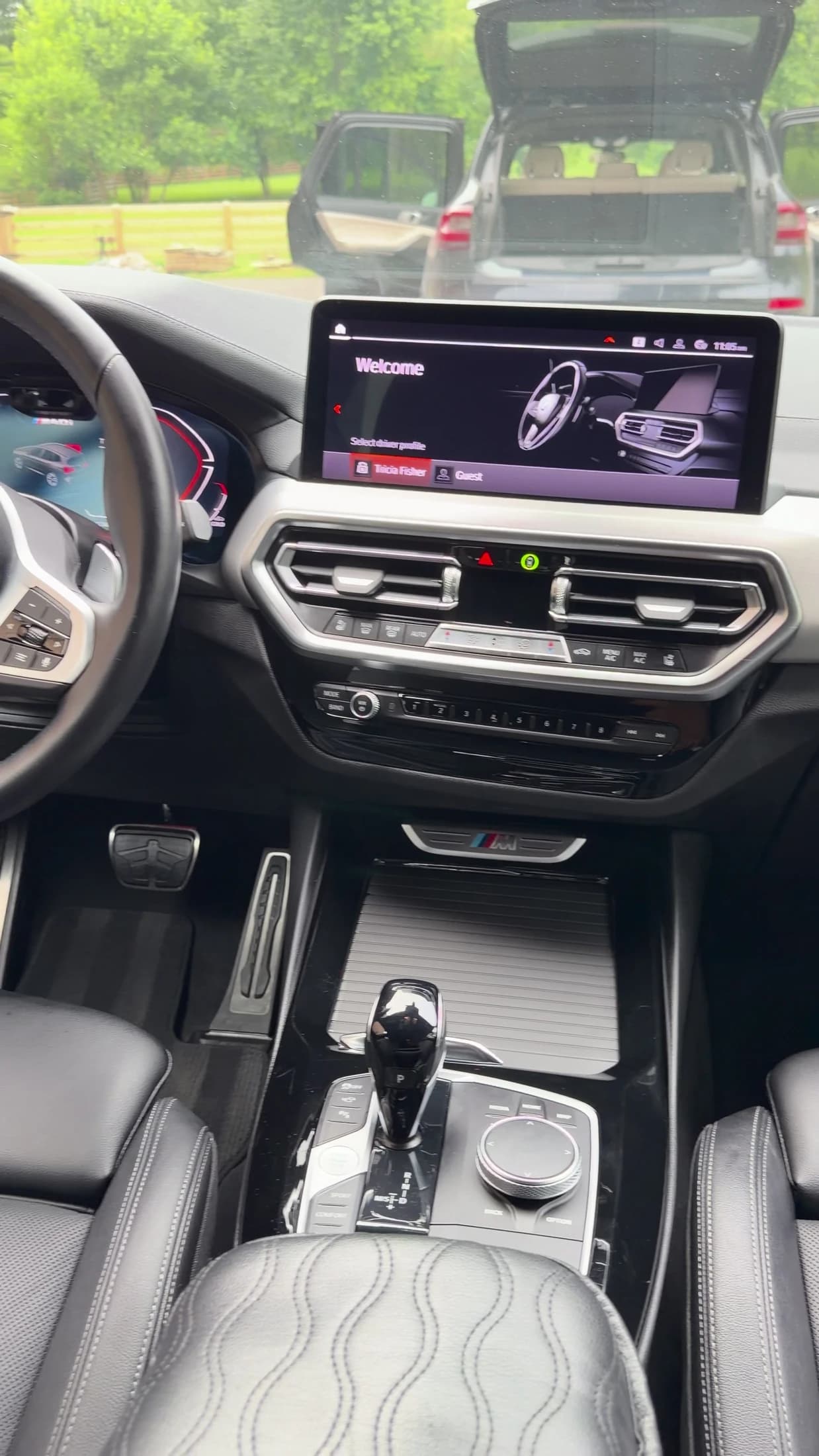 Clean BMW center console with wood trim, controls and leather surfaces