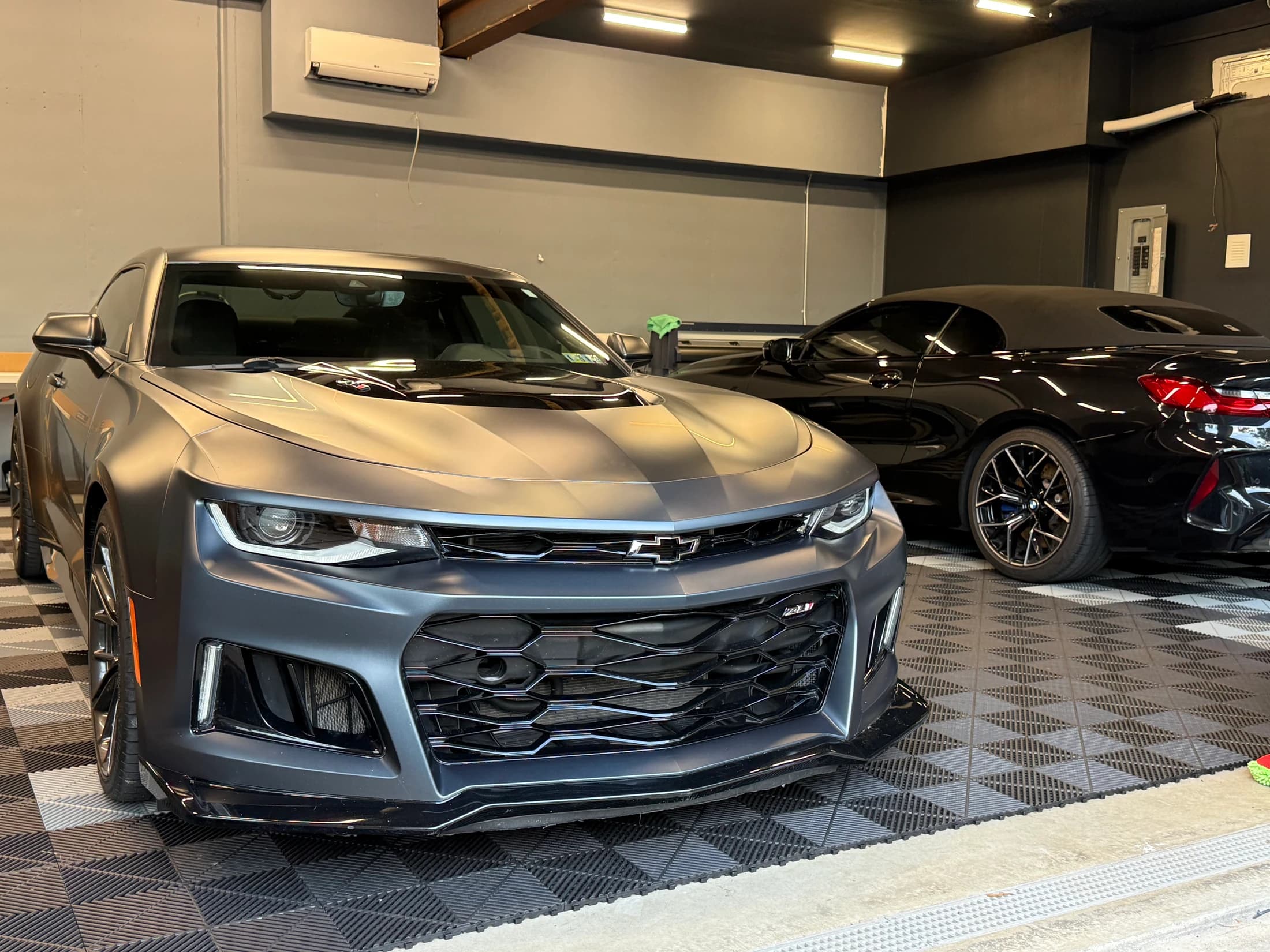 Satin gray Camaro ZL1 photographed from the front outside the studio